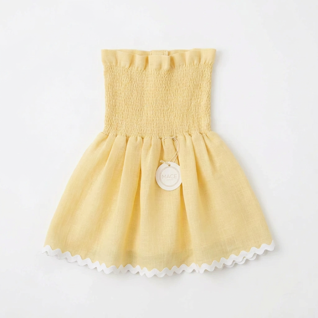 Blusa amarilla con ondulina blanca