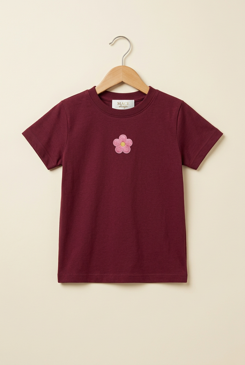 Camiseta infantil vino con flor rosa pequeña